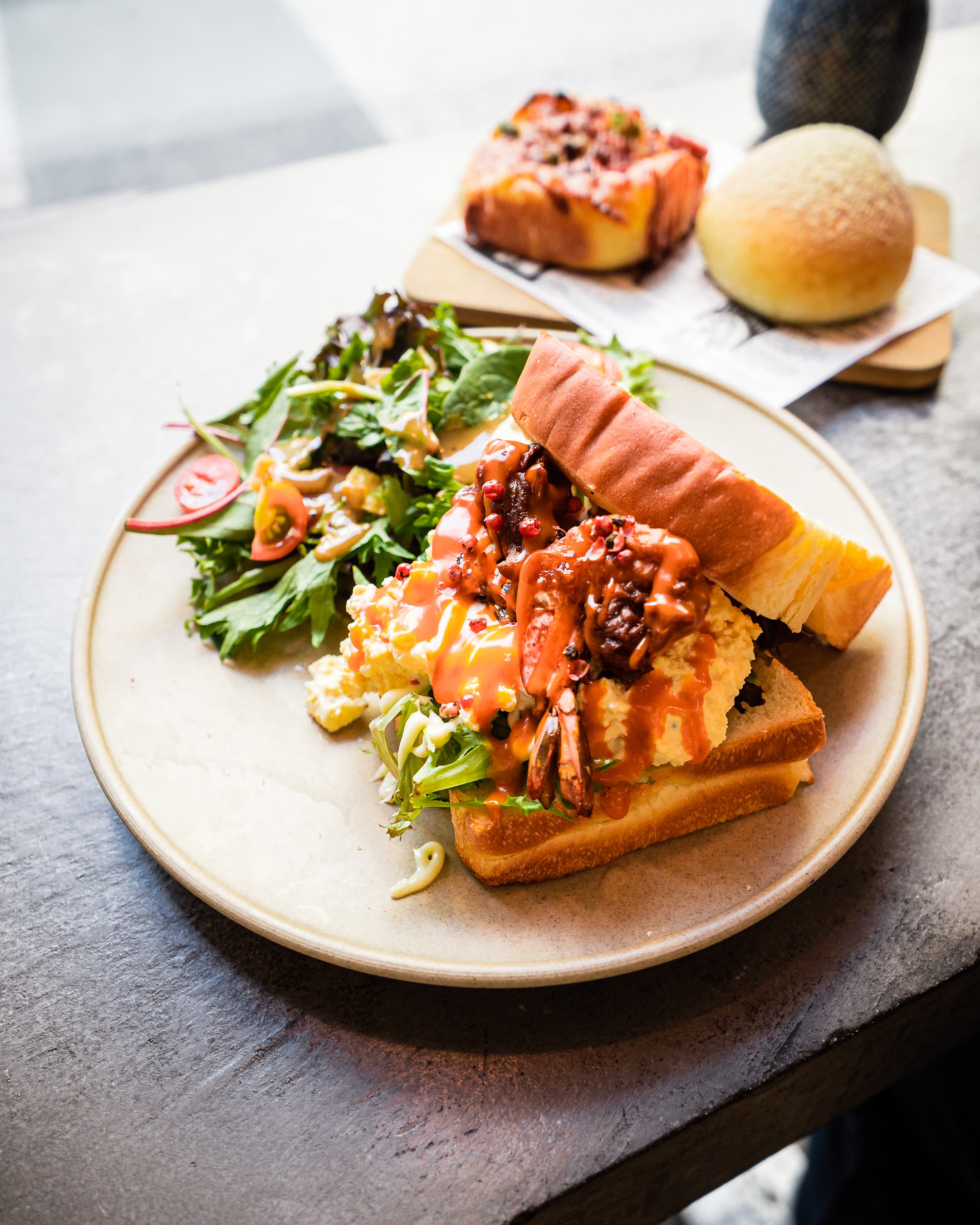 Fresh baked items and cafe setup at FUUMI BAKER in South Yarra